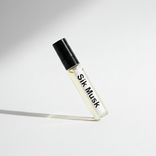 Small glass bottle labeled 'Silk Musk' on a white background